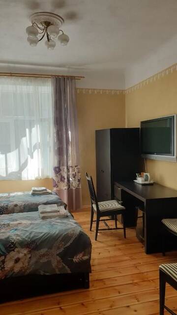 Фото номера Четырехместный номер с общей ванной комнатой Апартаменты Camino Cesis г. Цесис 22