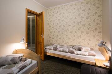 Фото номера Стандартный двухместный номер с 2 отдельными кроватями Отель Hotel Katrina г. Цесис 2
